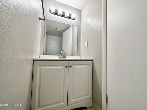 a view of a hallway with front door