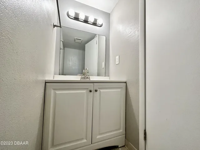 a view of a hallway with front door