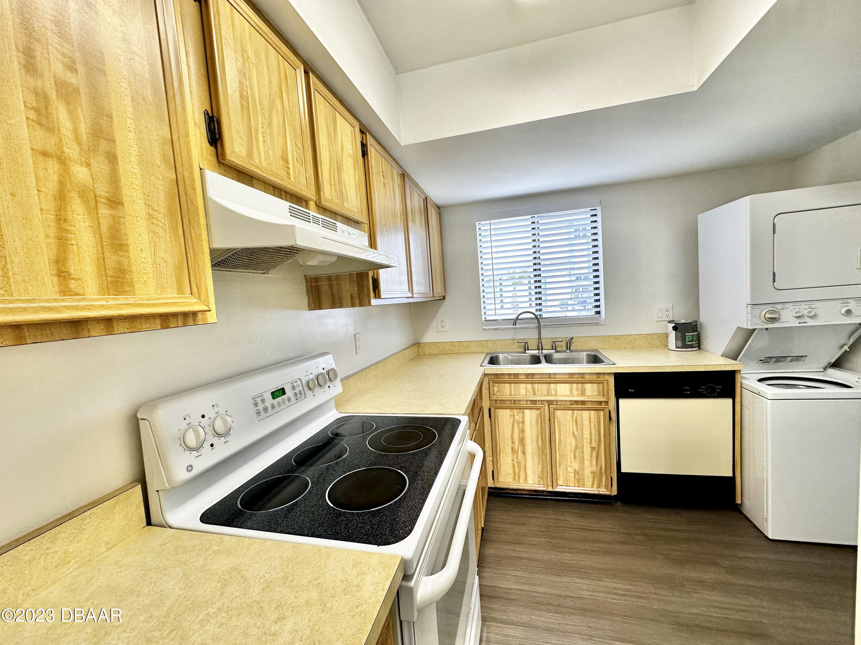 4790 South Atlantic Avenue, Unit D403 Ponce Inlet, FL 32127 - Photo 10 of 27 a kitchen with a stove a sink and a refrigerator