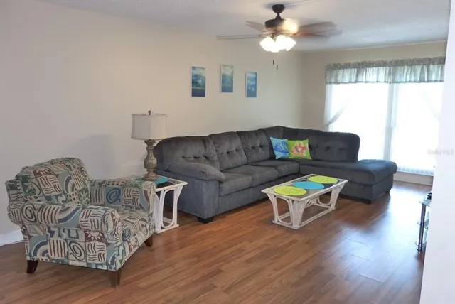 a living room with furniture and a window