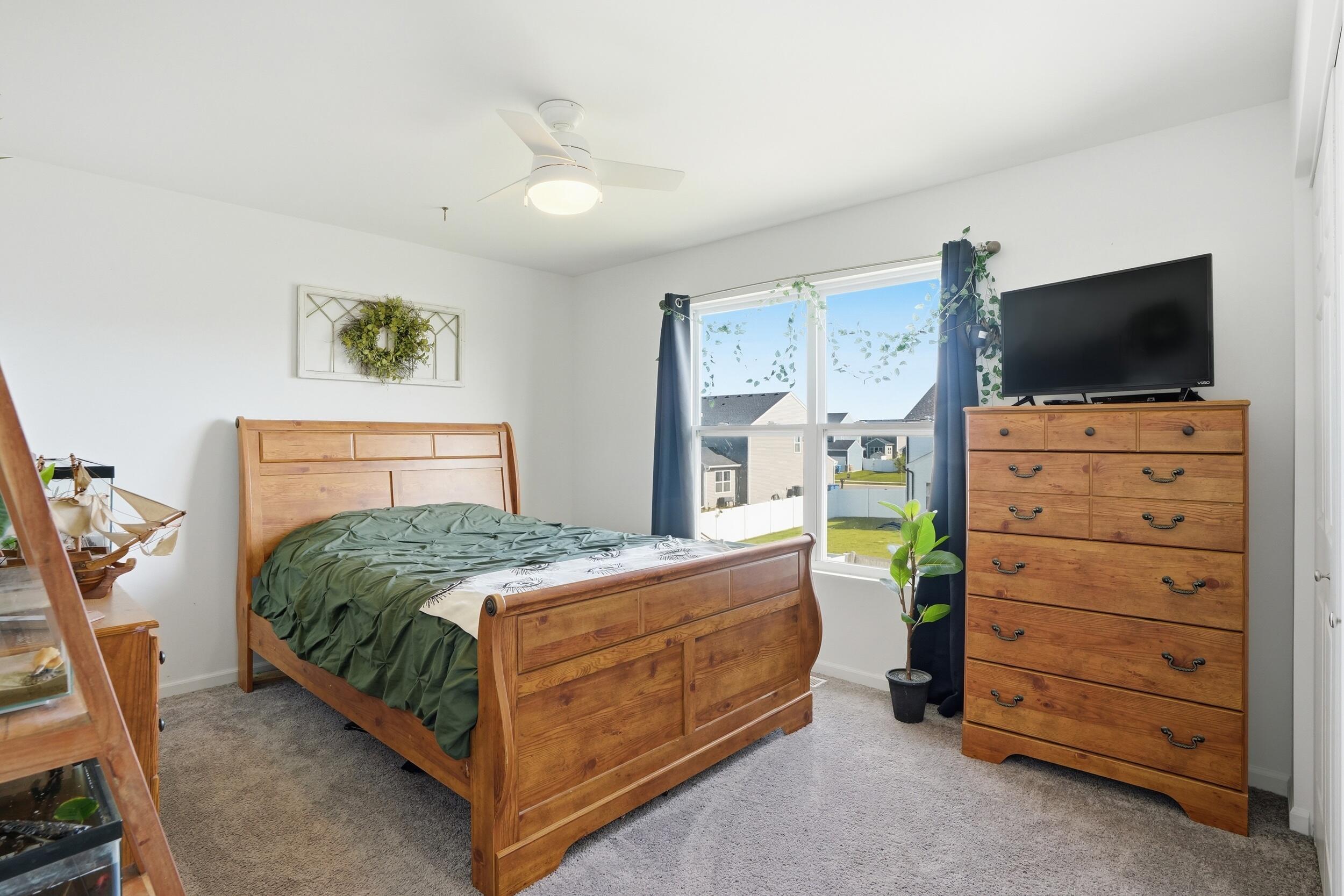8658 Valley Forge Way Lowell, IN 46356 - Photo 17 of 23 a bedroom with a bed and furniture