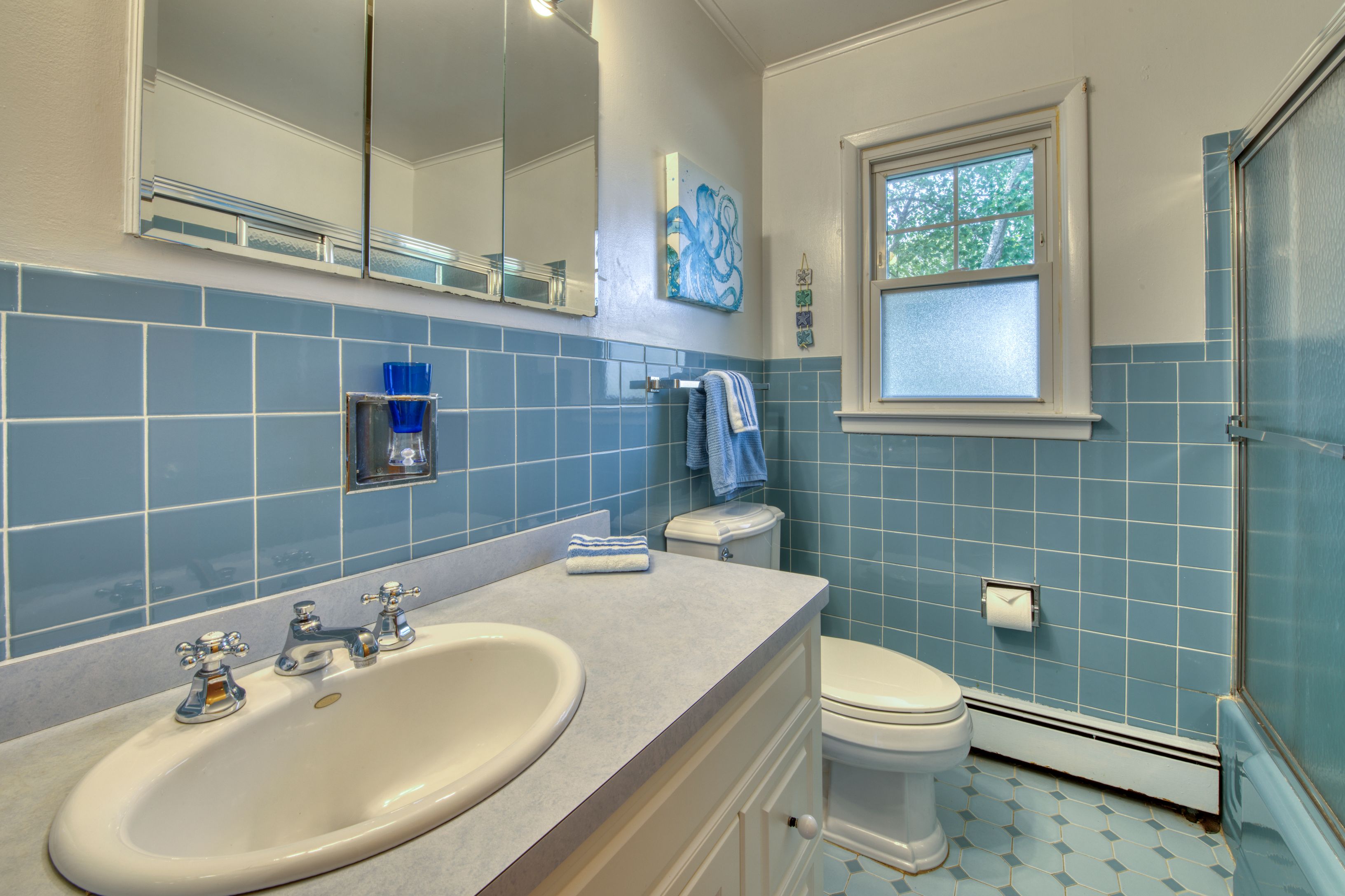 35 Ridge Drive Sag Harbor, NY 11963 - Photo 11 of 14 a bathroom with a sink a toilet and a mirror