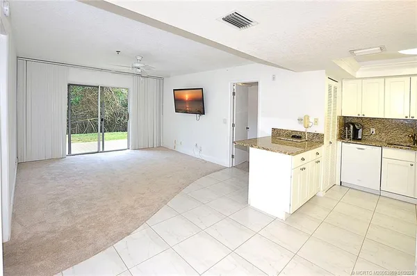 a kitchen with a stove a sink and a refrigerator