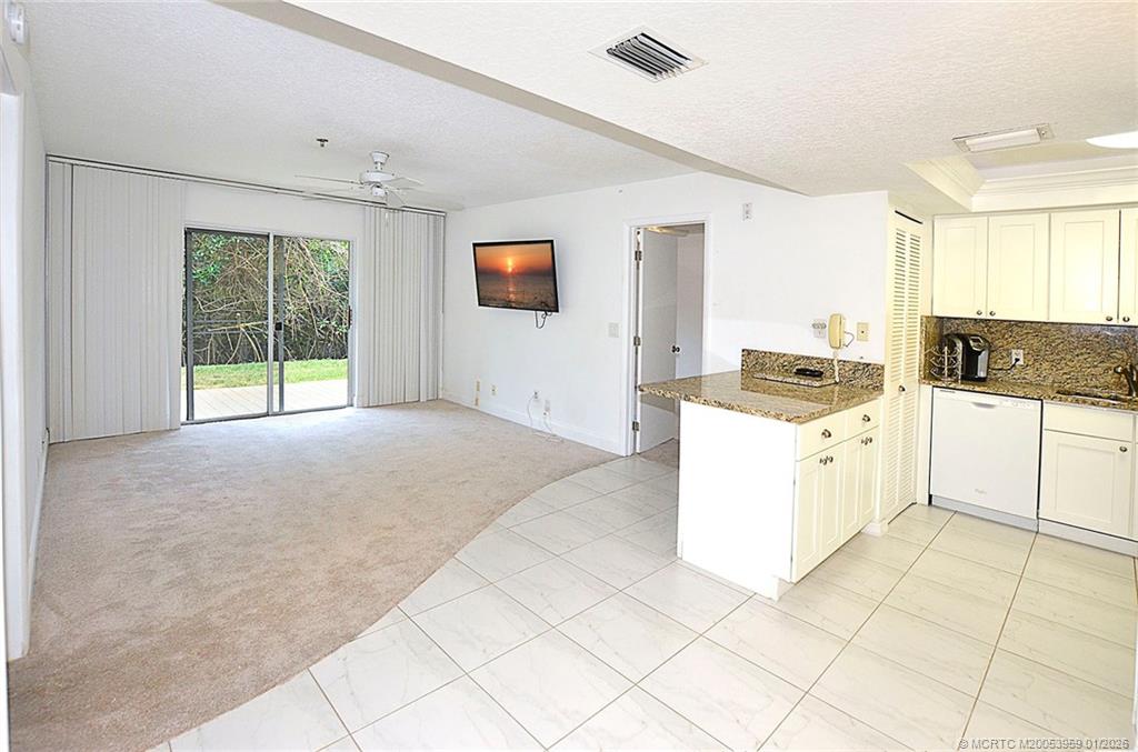 950 South Kanner Highway, Unit 9 Stuart, FL 34994 - Photo 1 of 22 a kitchen with a stove a sink and a refrigerator