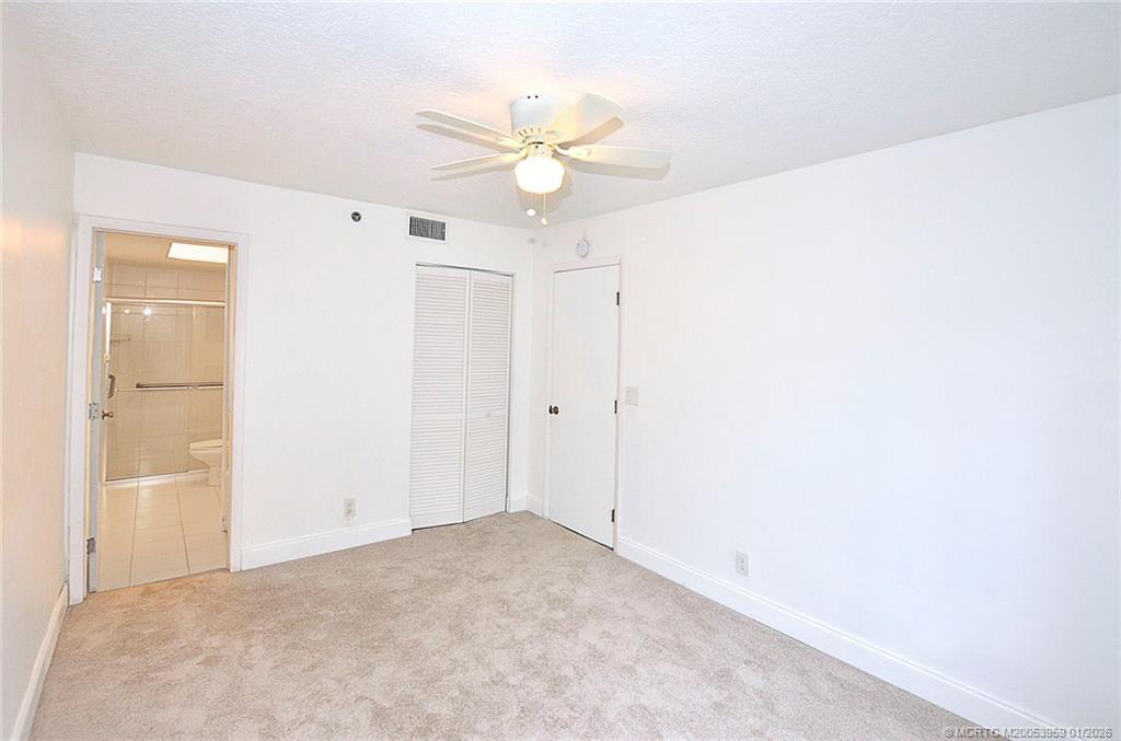 950 South Kanner Highway, Unit 9 Stuart, FL 34994 - Photo 14 of 22 a view of a hallway with a chandelier fan