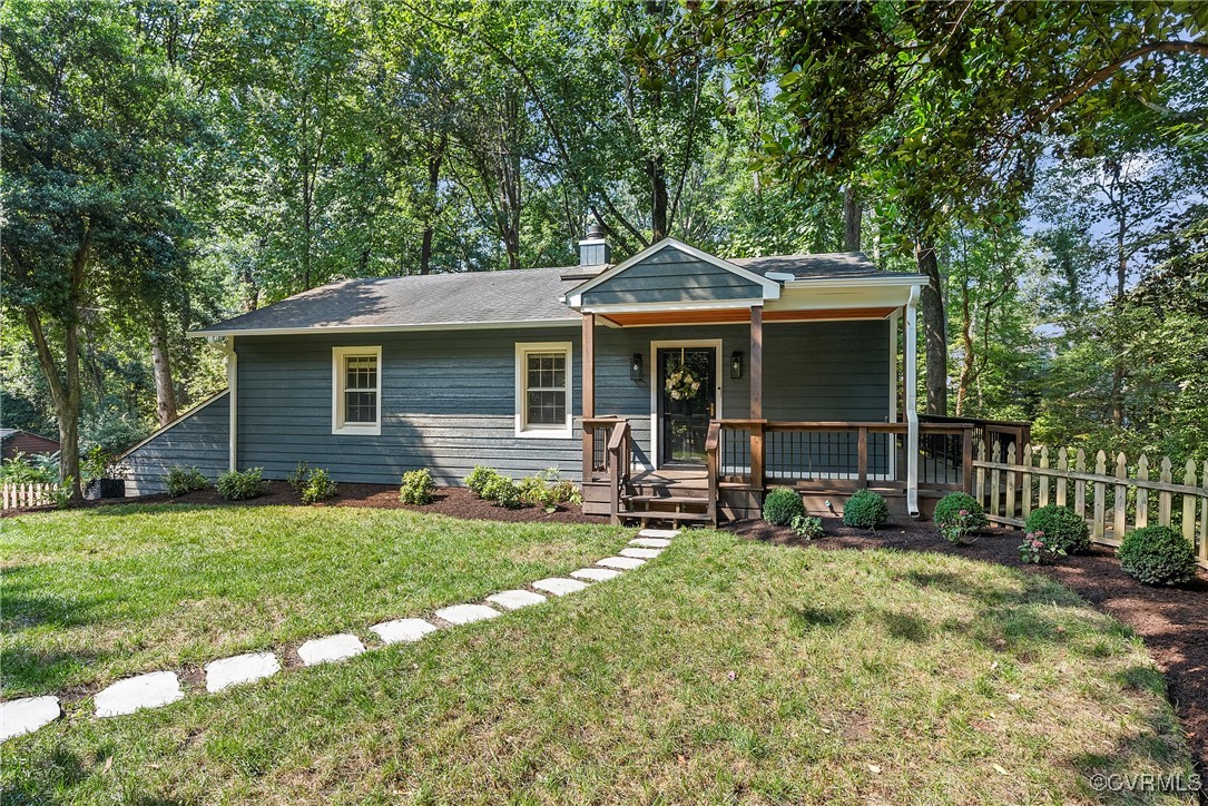 2502 Brookwood Road North Chesterfield, VA 23235 - Photo 1 of 32 a front view of a house with a yard table and chairs