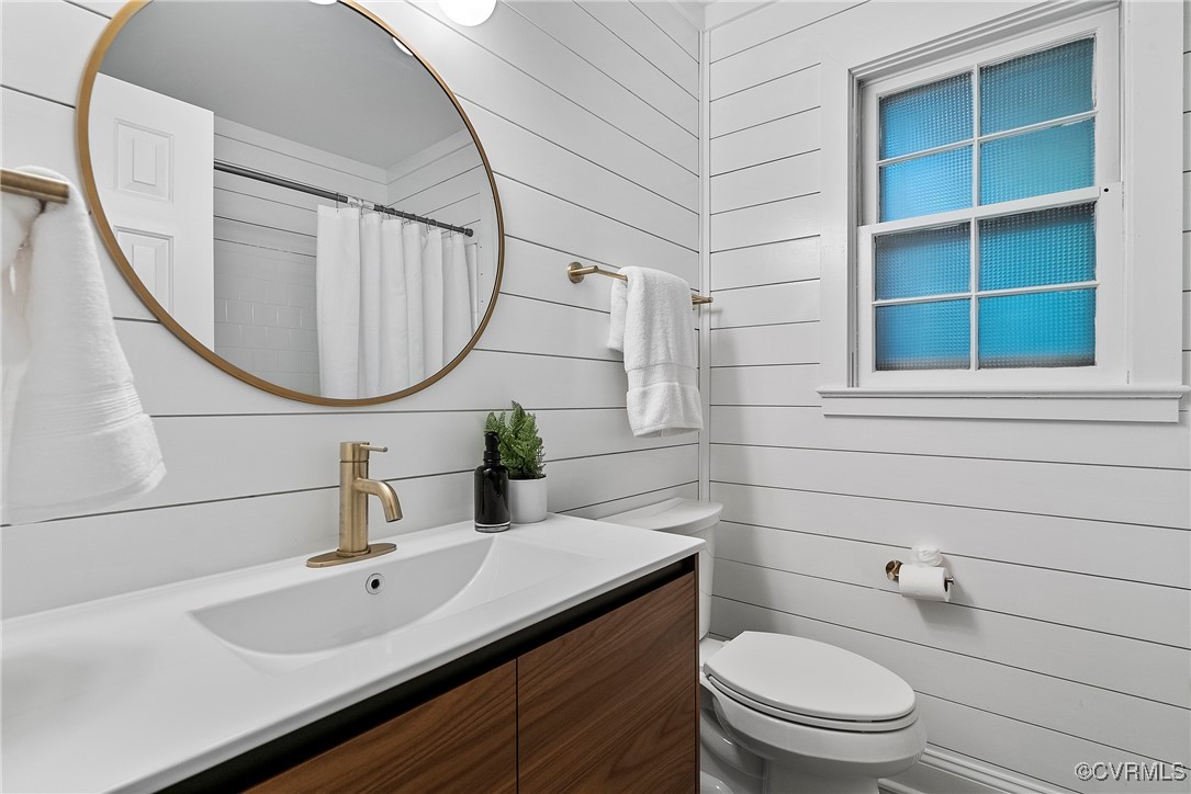 2502 Brookwood Road North Chesterfield, VA 23235 - Photo 16 of 32 a bathroom with a sink a toilet and a mirror