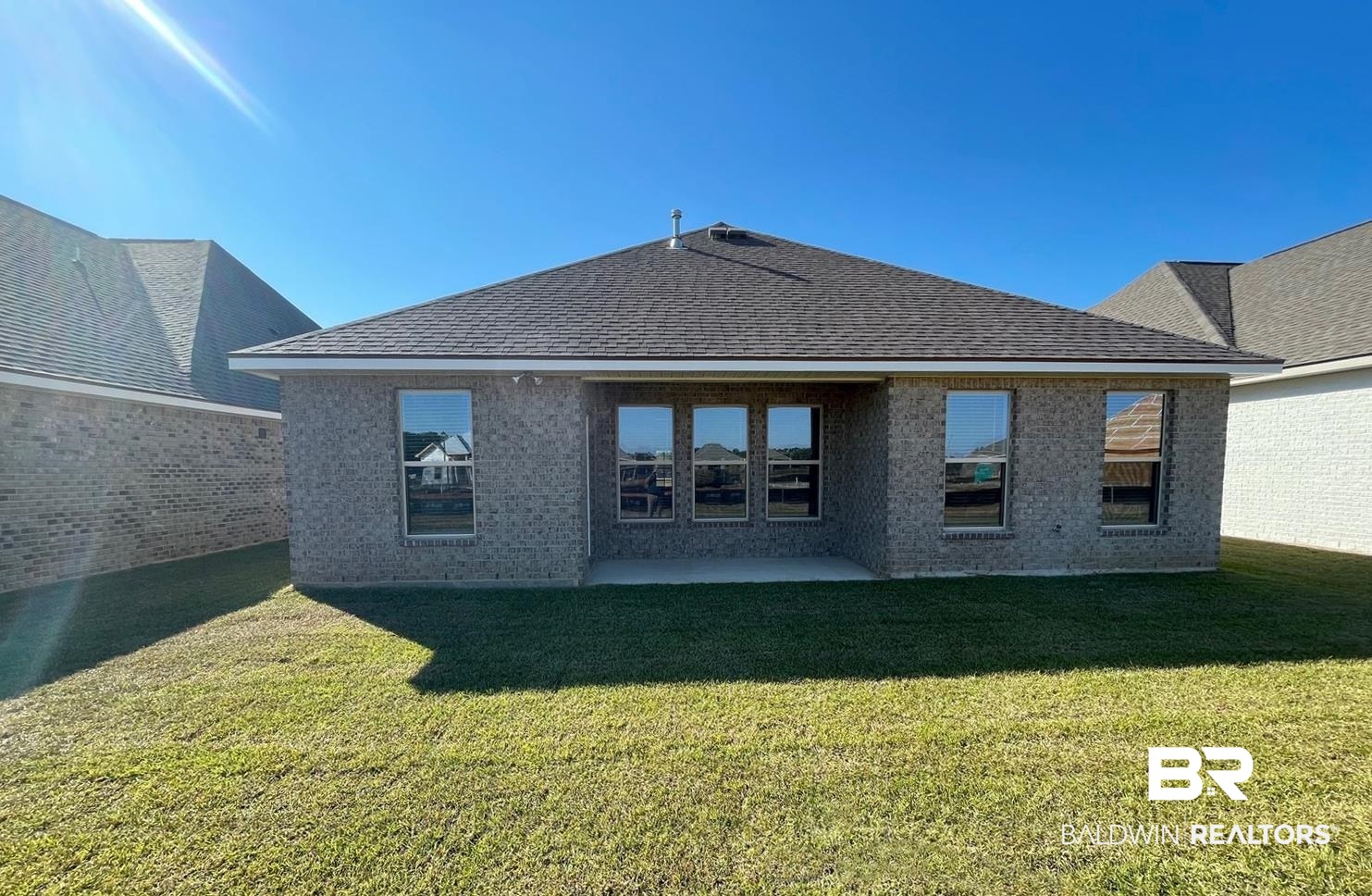 1579 Fenton Circle Foley, AL 36535 - Photo 12 of 14 Back of house with a patio area and a yard