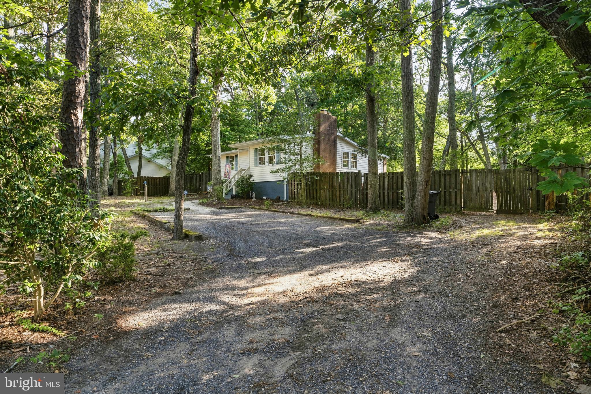 Private drive with parking area.