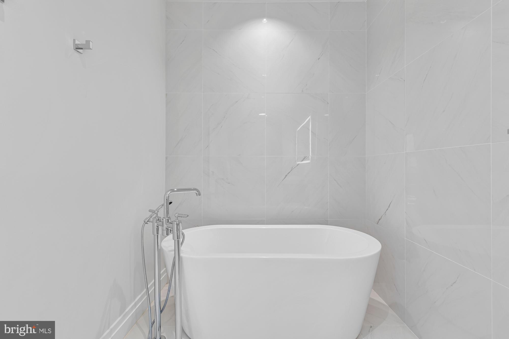 1427 Rhode Island Avenue Northwest, Unit PH01 Washington, DC 20005 - Photo 26 of 60 a bathroom with a bathtub