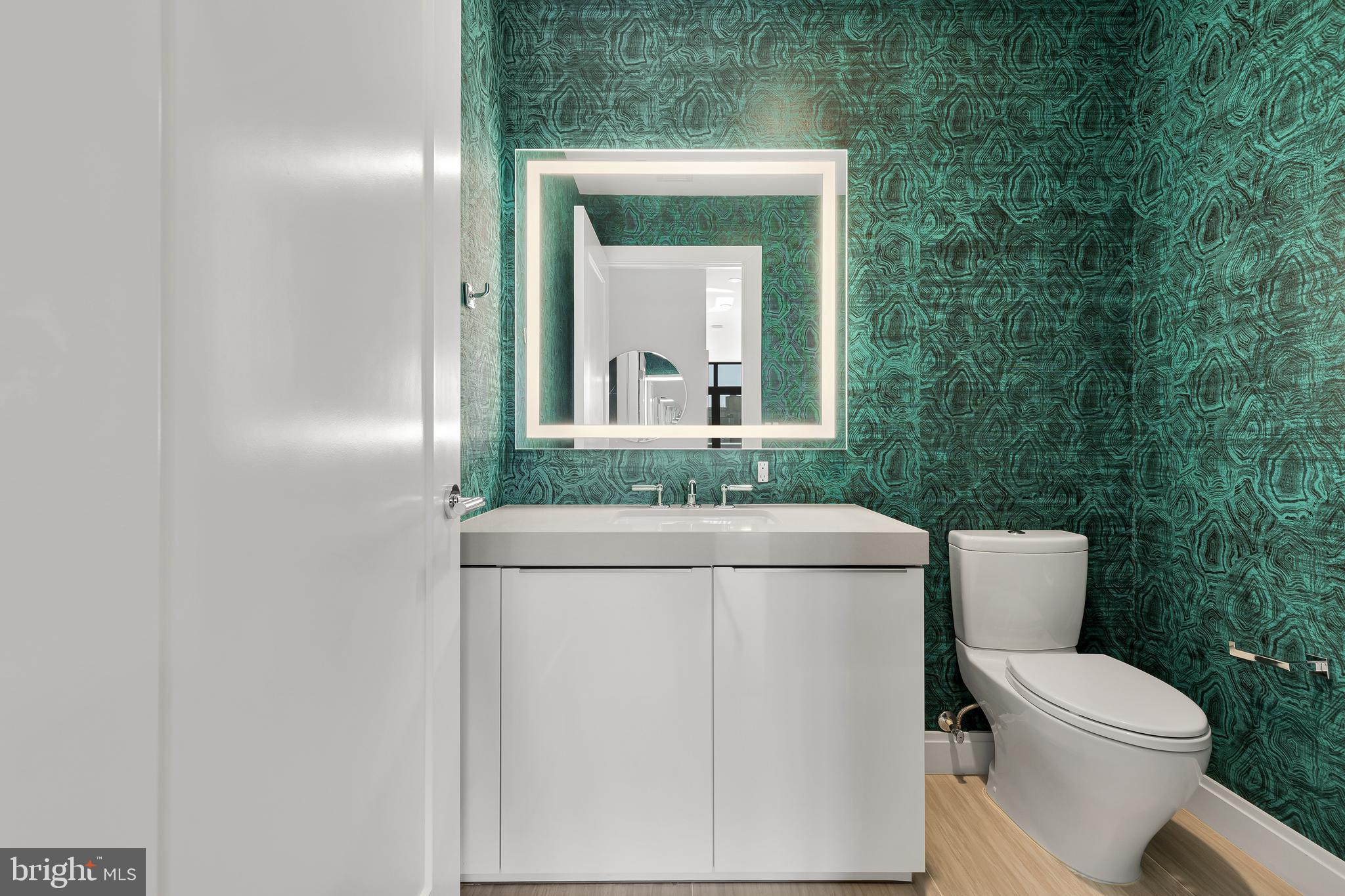 1427 Rhode Island Avenue Northwest, Unit PH01 Washington, DC 20005 - Photo 29 of 60 a bathroom with a toilet and a sink