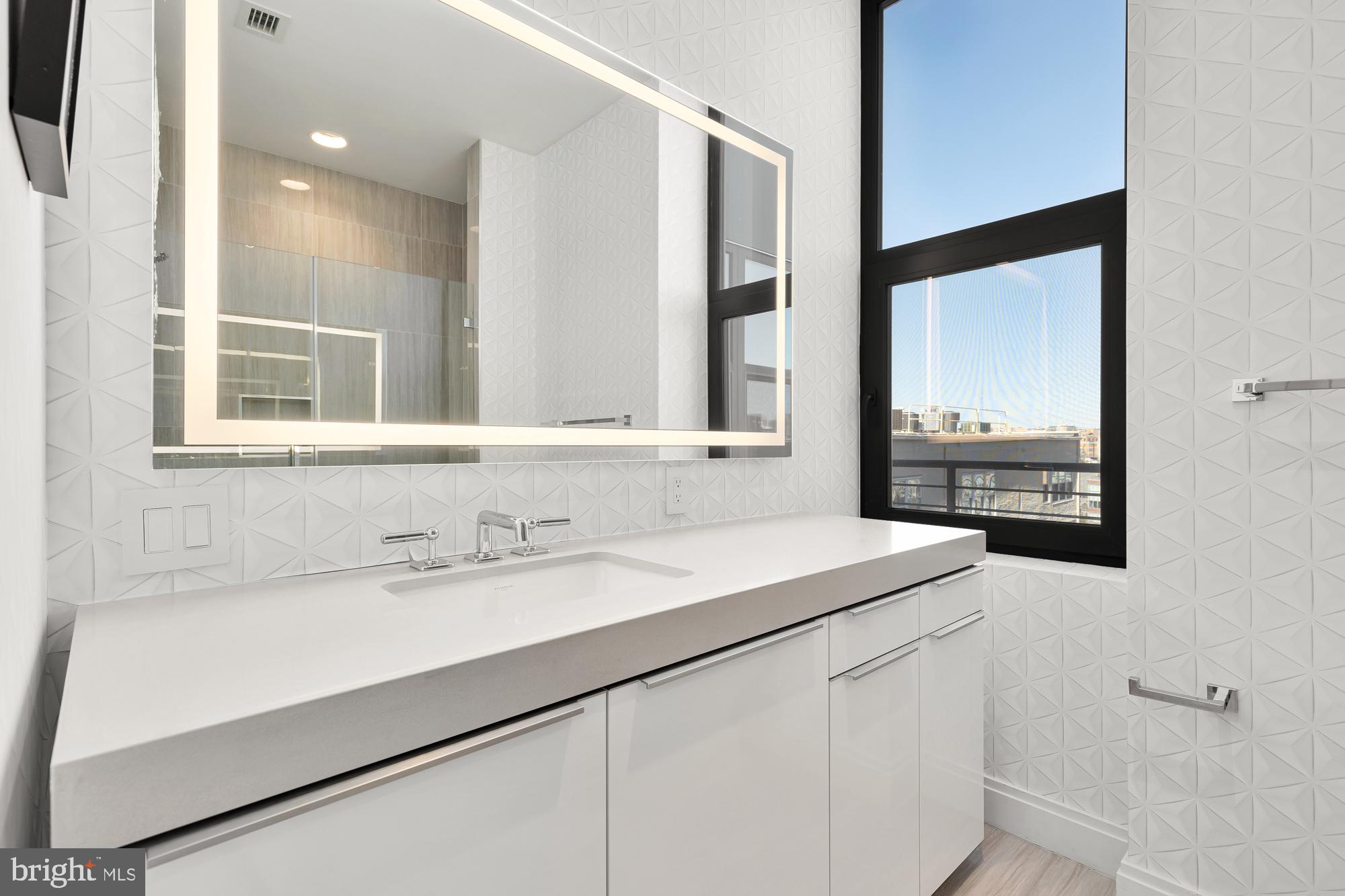 1427 Rhode Island Avenue Northwest, Unit PH01 Washington, DC 20005 - Photo 32 of 60 a bathroom with a sink and a mirror