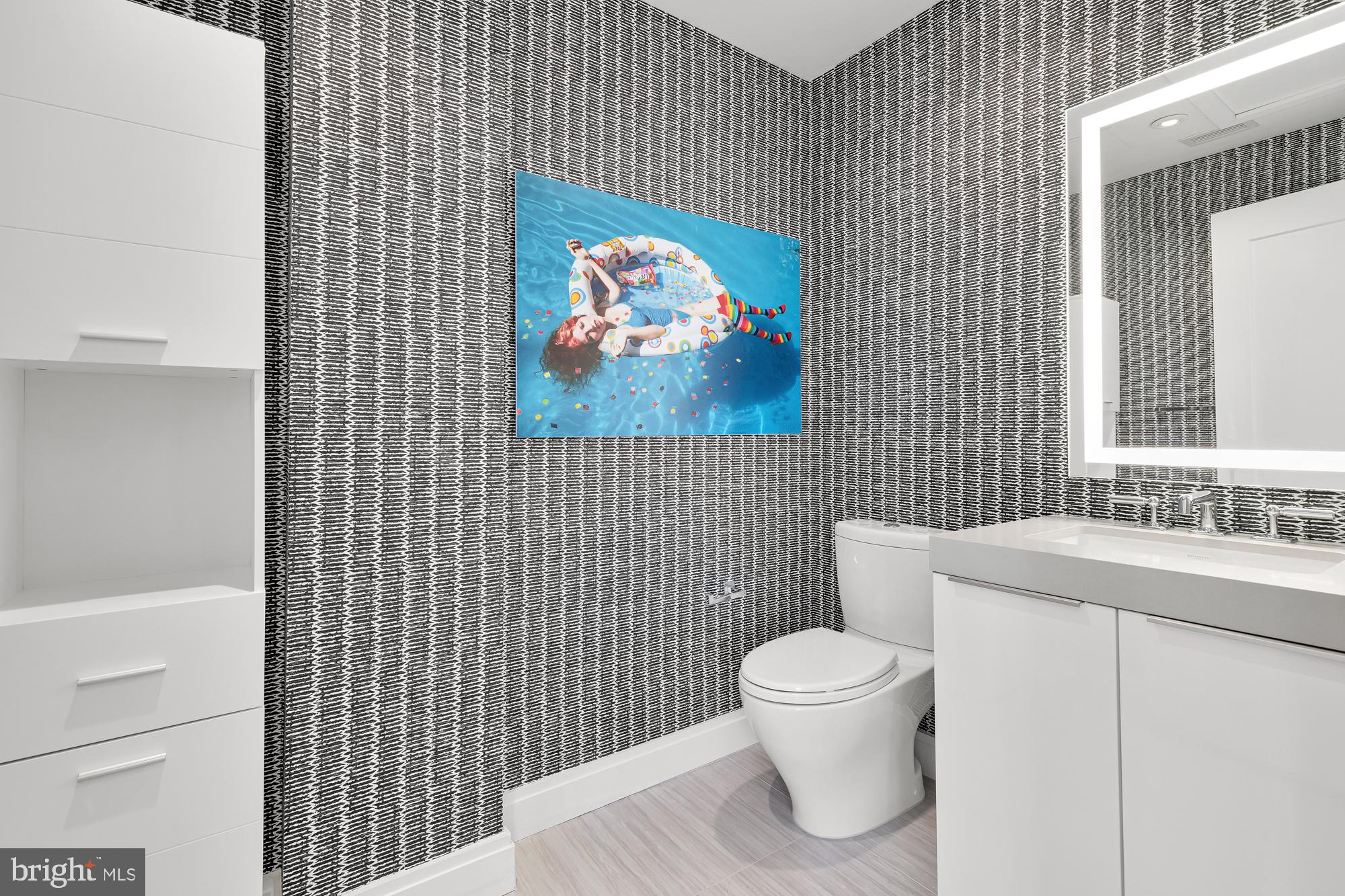 1427 Rhode Island Avenue Northwest, Unit PH01 Washington, DC 20005 - Photo 42 of 60 a bathroom with a toilet and a sink