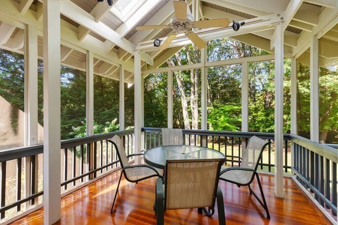 75 Cedar Street Lexington, MA 02421 - Photo 13 of 42 a view of a patio with a table chairs and wooden floor