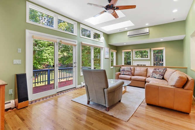 75 Cedar Street Lexington, MA 02421 - Photo 14 of 42 a living room with furniture and a large window