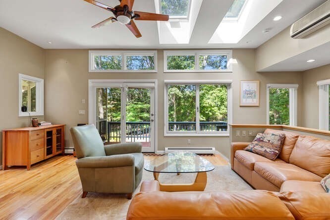75 Cedar Street Lexington, MA 02421 - Photo 15 of 42 a living room with furniture and a large window