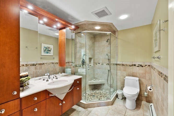 75 Cedar Street Lexington, MA 02421 - Photo 16 of 42 a bathroom with a sink a toilet and shower