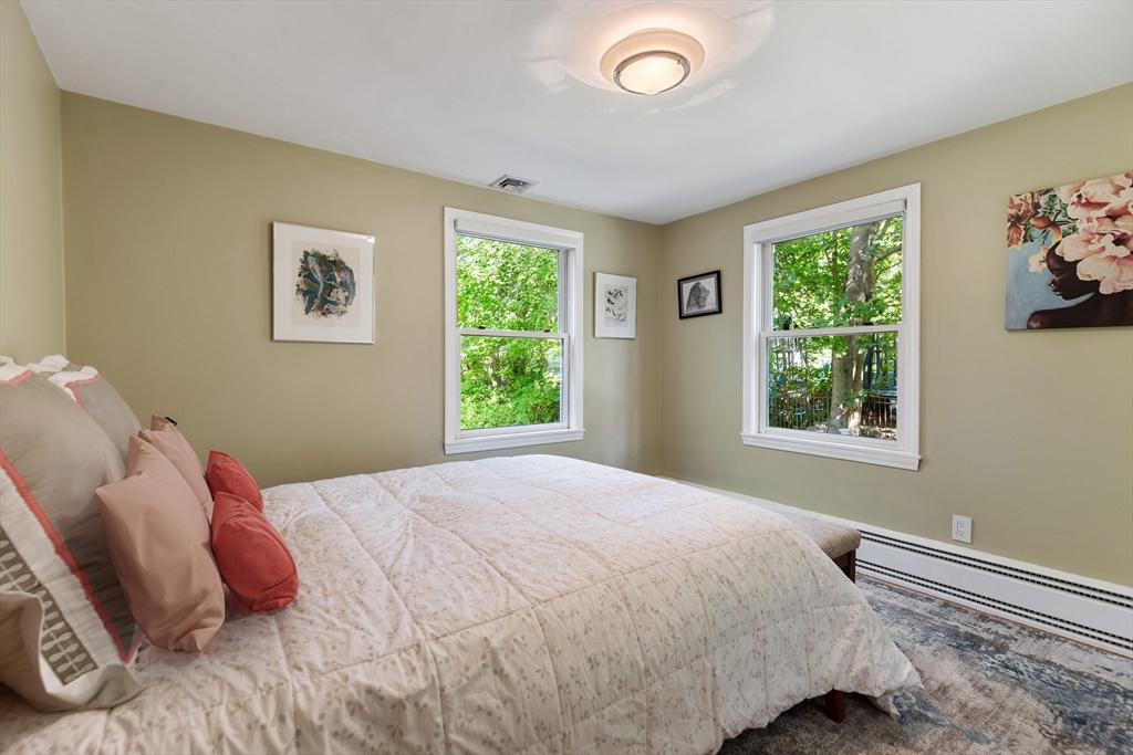 75 Cedar Street Lexington, MA 02421 - Photo 17 of 42 a bedroom with a bed and a window