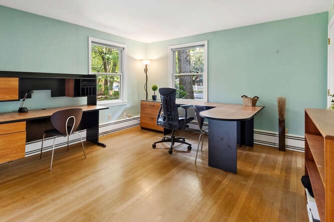 75 Cedar Street Lexington, MA 02421 - Photo 18 of 42 a view of a workspace with furniture and a window