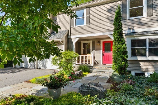 75 Cedar Street Lexington, MA 02421 - Photo 2 of 42 a front view of a house with a yard and potted plants