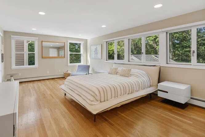 75 Cedar Street Lexington, MA 02421 - Photo 21 of 42 a spacious bedroom with a bed and a large window