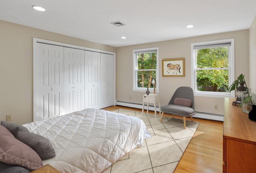75 Cedar Street Lexington, MA 02421 - Photo 29 of 42 a bedroom with a bed and a couch