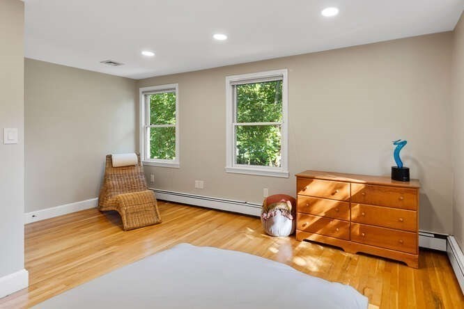 75 Cedar Street Lexington, MA 02421 - Photo 30 of 42 a room with wooden floor and a window
