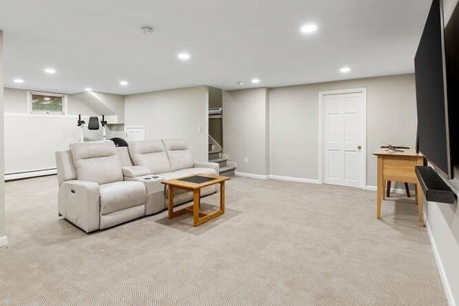 75 Cedar Street Lexington, MA 02421 - Photo 31 of 42 a living room with furniture and a flat screen tv