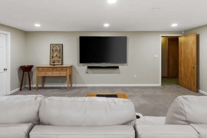 75 Cedar Street Lexington, MA 02421 - Photo 32 of 42 a living room with furniture and a flat screen tv