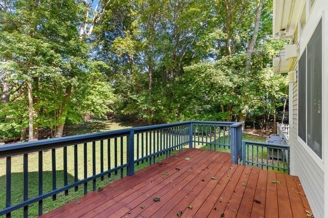 75 Cedar Street Lexington, MA 02421 - Photo 35 of 42 a view of balcony with wooden floor and fence