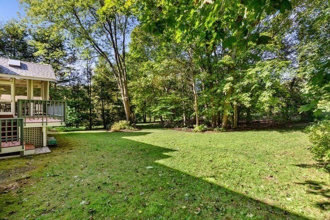 75 Cedar Street Lexington, MA 02421 - Photo 39 of 42 a view of a backyard with large trees