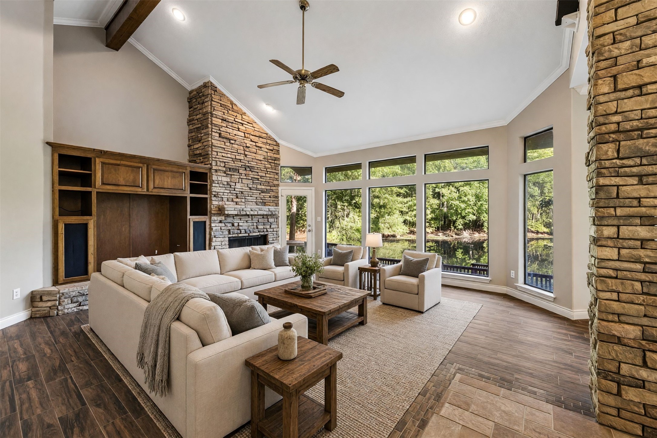 424 Nursery Road Spring, TX 77380 - Photo 1 of 16 Grand family room with stone fireplace, soaring ceilings and a full view of the outdoors. *virtually staged