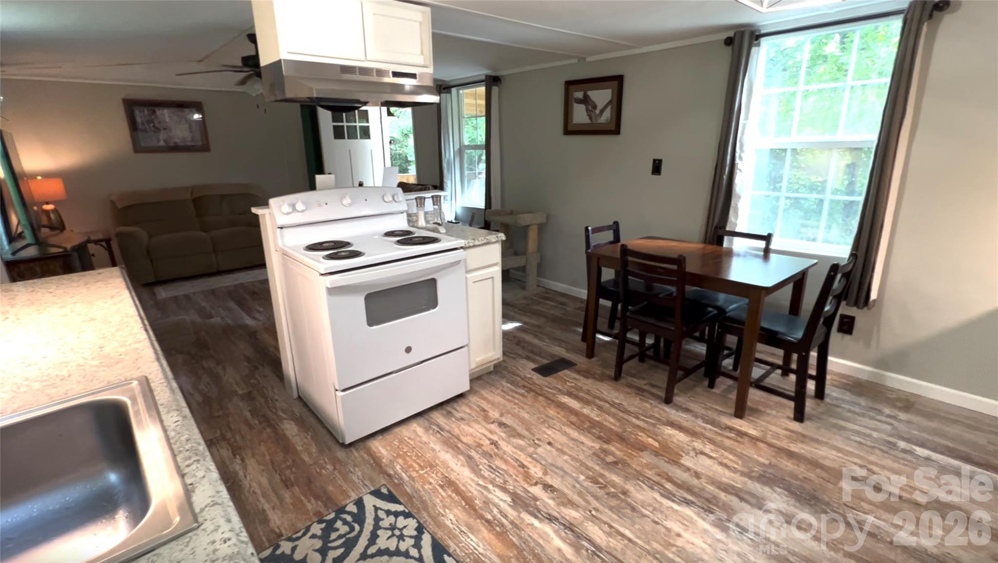 1019 Hudlin Gap Road Pisgah Forest, NC 28768 - Photo 15 of 24 a view of a dining room with furniture window and outside view