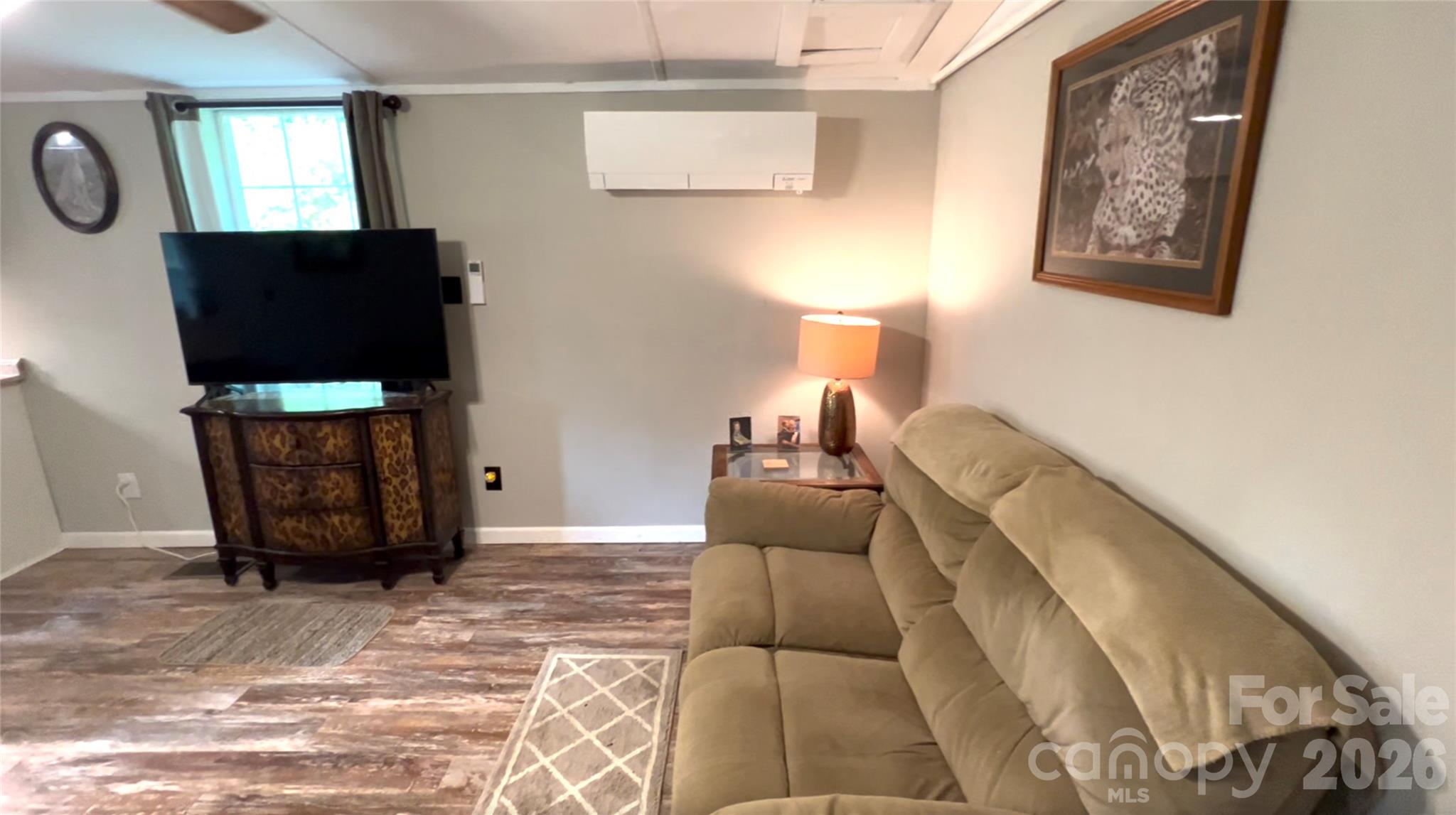 1019 Hudlin Gap Road Pisgah Forest, NC 28768 - Photo 16 of 24 a living room with furniture and a flat screen tv