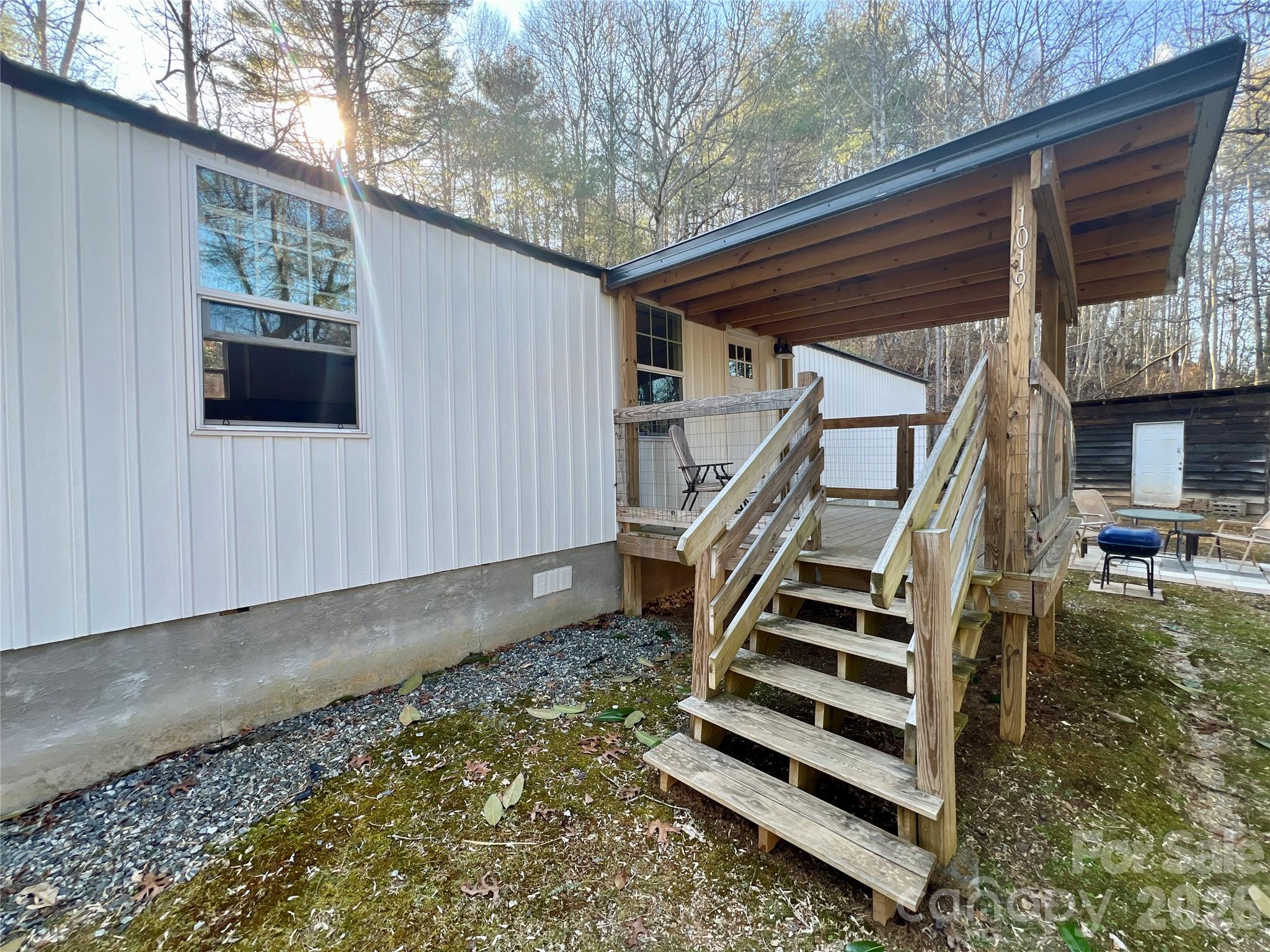 1019 Hudlin Gap Road Pisgah Forest, NC 28768 - Photo 2 of 24 a view of entryway with wooden floor