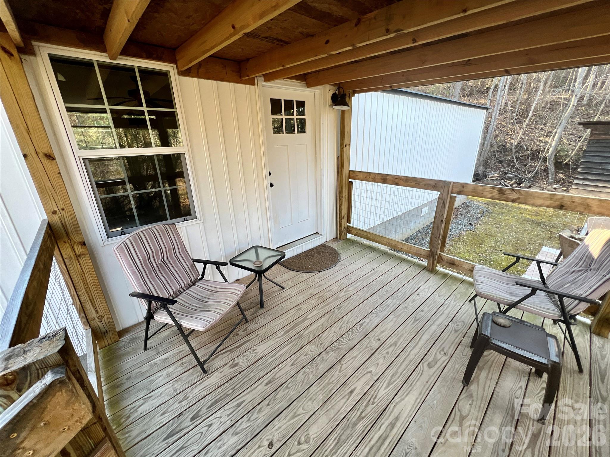 1019 Hudlin Gap Road Pisgah Forest, NC 28768 - Photo 3 of 24 a view of balcony with wooden floor and seating space
