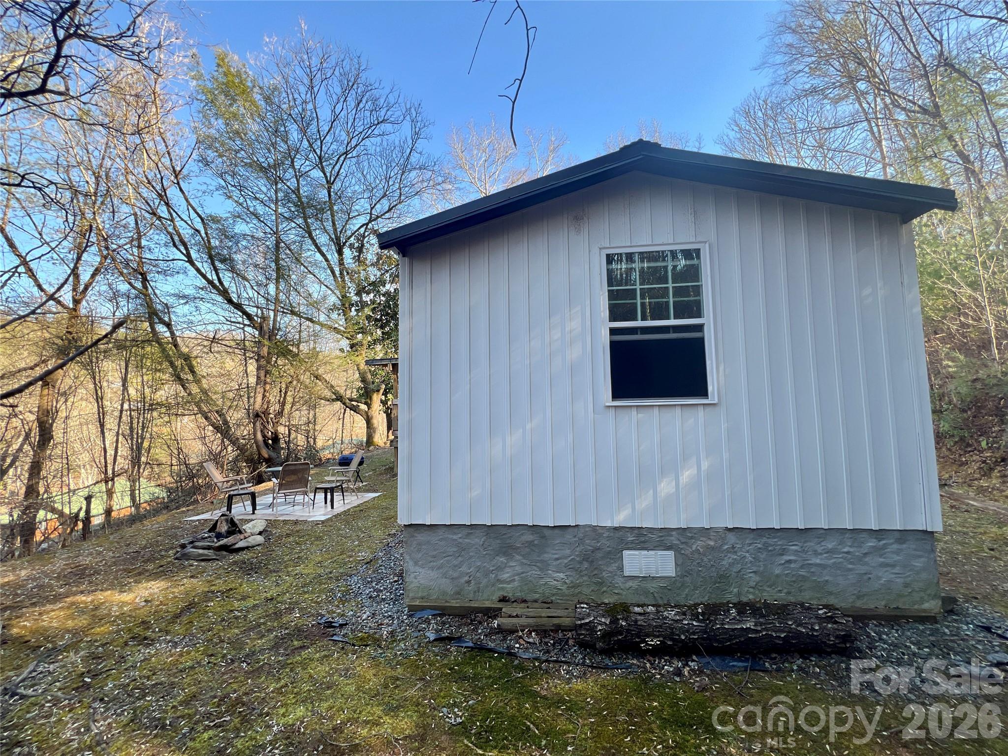 1019 Hudlin Gap Road Pisgah Forest, NC 28768 - Photo 7 of 24 a view of a house with a yard