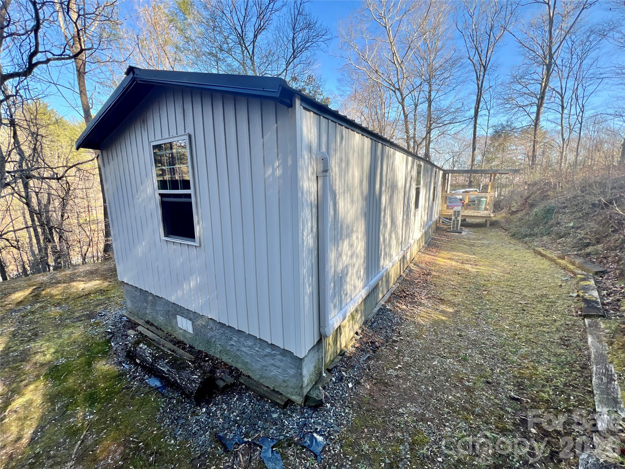 1019 Hudlin Gap Road Pisgah Forest, NC 28768 - Photo 8 of 24 a view of a house with a yard