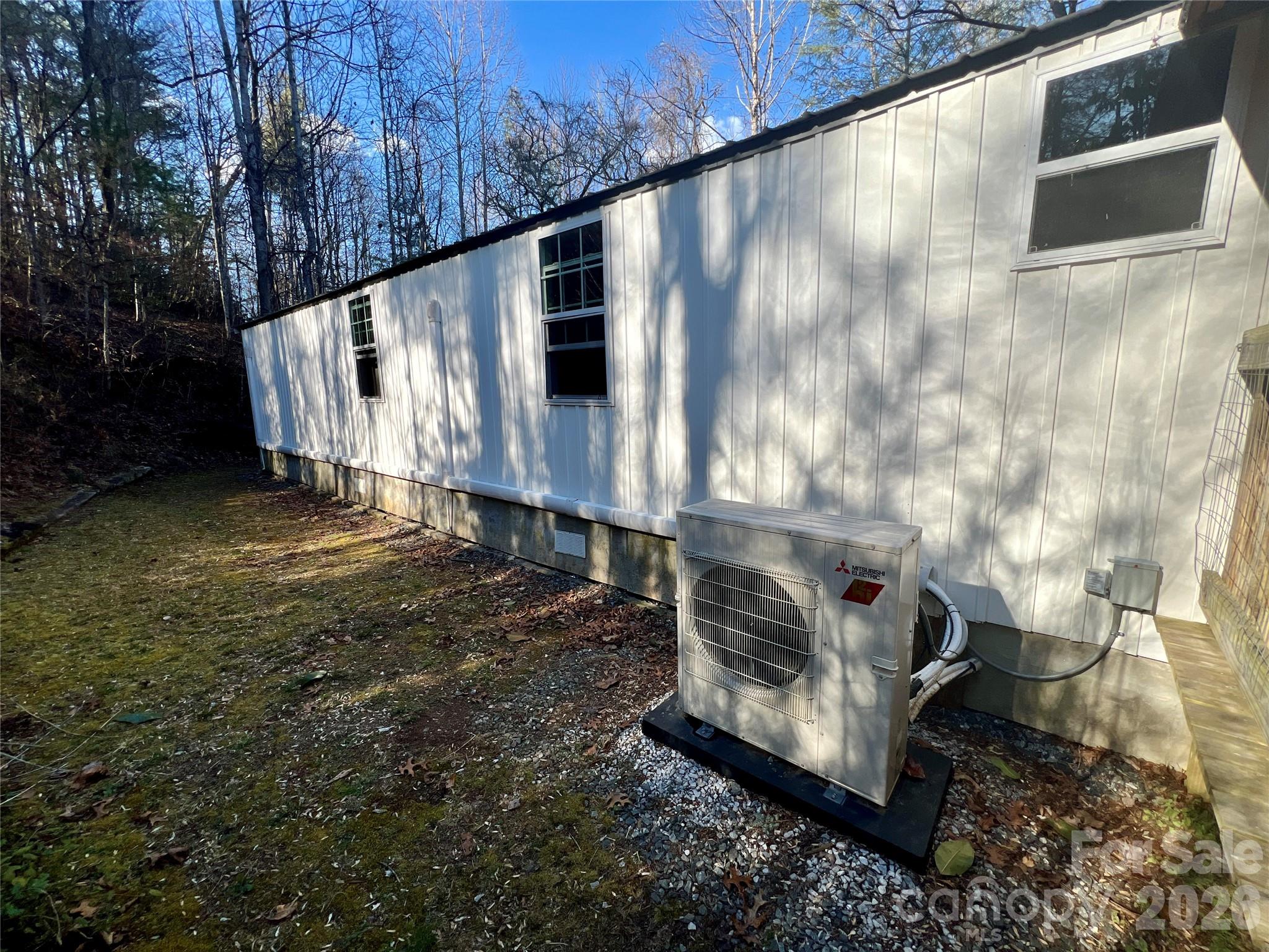 1019 Hudlin Gap Road Pisgah Forest, NC 28768 - Photo 9 of 24 a view of a back yard of the house