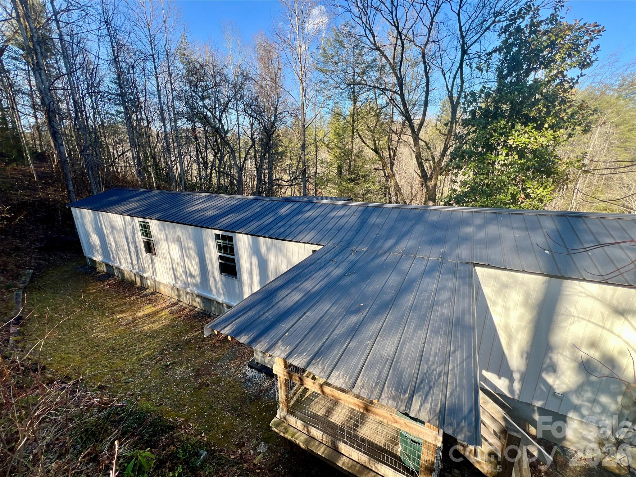 1019 Hudlin Gap Road Pisgah Forest, NC 28768 - Photo 10 of 24 a view of a house with a yard