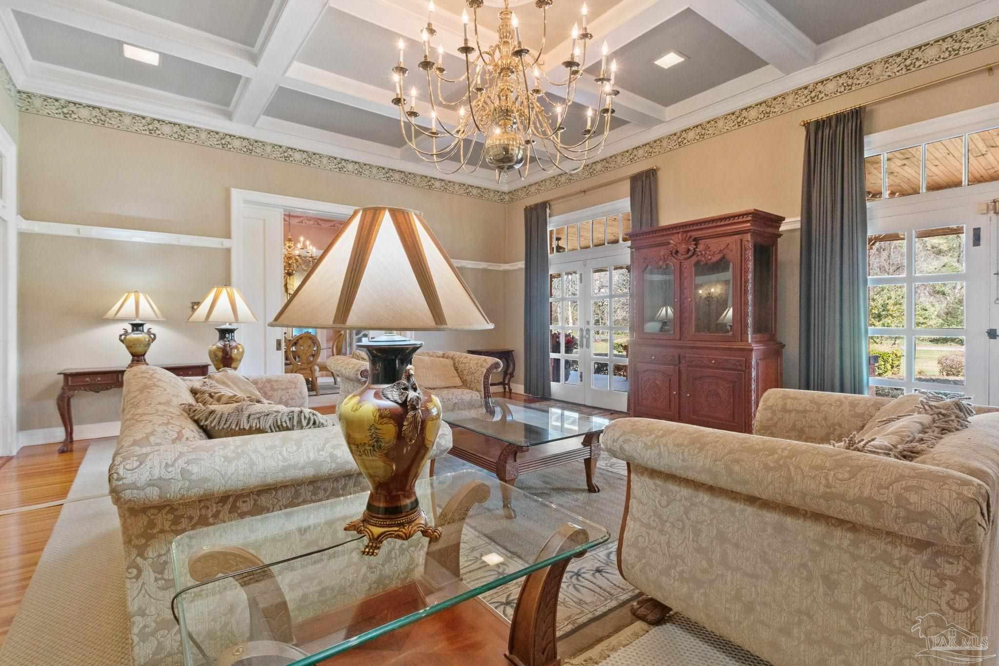 1701 Sowell Road Brewton, AL 36426 - Photo 24 of 72 a living room with furniture and a chandelier