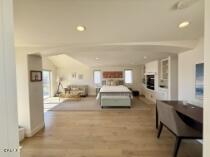 3744 Ocean Drive Oxnard, CA 93035 - Photo 13 of 15 a bedroom with furniture and a mirror