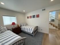 3744 Ocean Drive Oxnard, CA 93035 - Photo 6 of 15 a bedroom with two beds and a closet