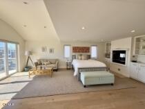 3744 Ocean Drive Oxnard, CA 93035 - Photo 7 of 15 a spacious bedroom with a large bed and a tv