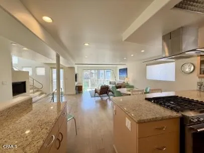 a kitchen with a stove and cabinets