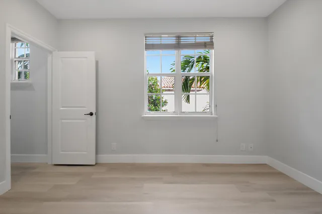 a view of kitchen with kitchen island wooden floor and center island