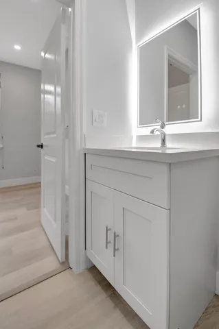 a bathroom with a sink and a mirror