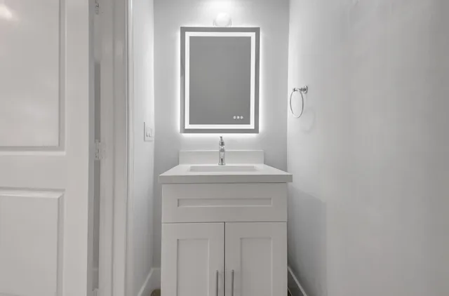 a bathroom with a sink and a mirror