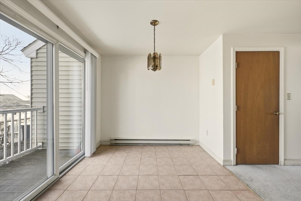 87 Victoria Heights Road, Unit 87 Boston, MA 02136 - Photo 12 of 32 a view of a room with sliding door