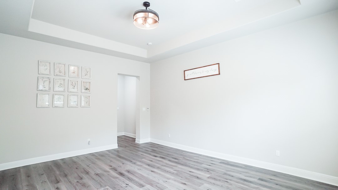 629 Germander Road Leander, TX 78641 - Photo 25 of 38 an empty room with wooden floor and windows